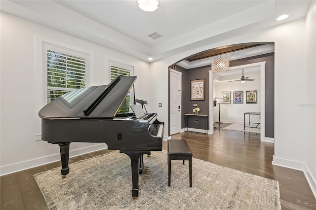 311 12th Ave N, Saint Petersburg, FL 33701 - living area featuring a raised ceiling, arched walkways, wood finished floors, a ceiling fan, and recessed lighting