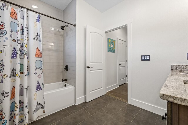 311 12th Ave N, Saint Petersburg, FL 33701 - bathroom featuring vanity, shower / bathtub combination with curtain, and tile patterned floors