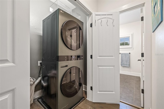 311 12th Ave N, Saint Petersburg, FL 33701 - washroom with stacked washer / drying machine and baseboards