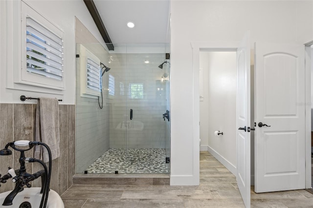 311 12th Ave N, Saint Petersburg, FL 33701 - bathroom with a shower stall and wood finished floors