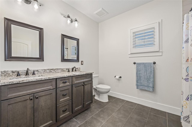 311 12th Ave N, Saint Petersburg, FL 33701 - bathroom with double vanity, tile patterned floors, and a shower with curtain
