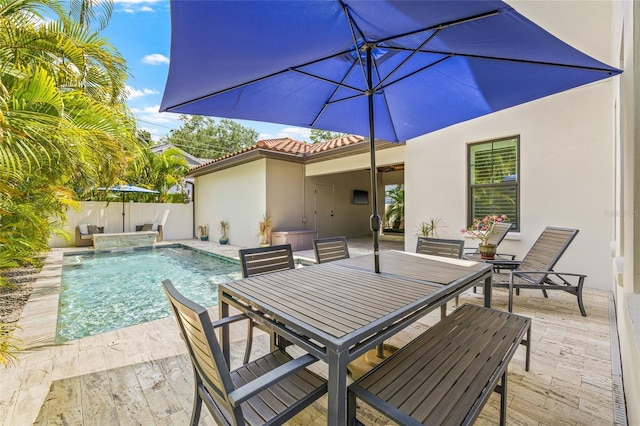 311 12th Ave N, Saint Petersburg, FL 33701 - view of swimming pool featuring outdoor dining space, a fenced backyard, and a patio area