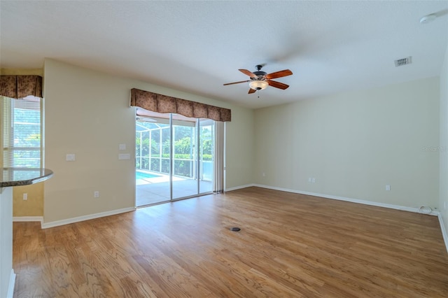 5315 Cedarshake Ln, Valrico, FL 33596 - unfurnished room featuring light wood-type flooring, ceiling fan, and a smoke detector
