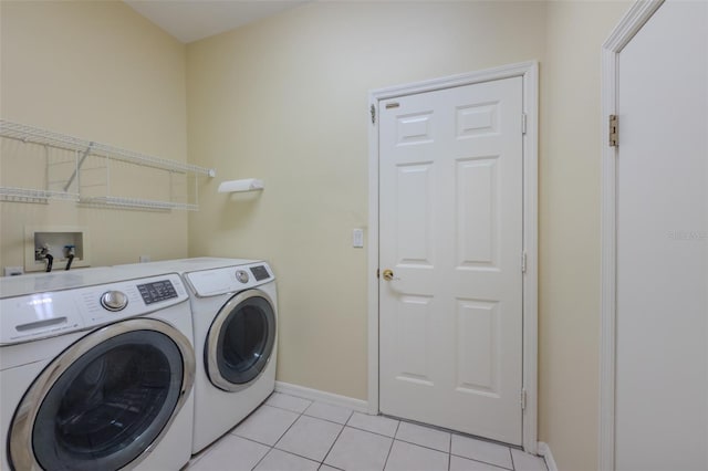 5315 Cedarshake Ln, Valrico, FL 33596 - washroom with washer and dryer and light tile patterned floors