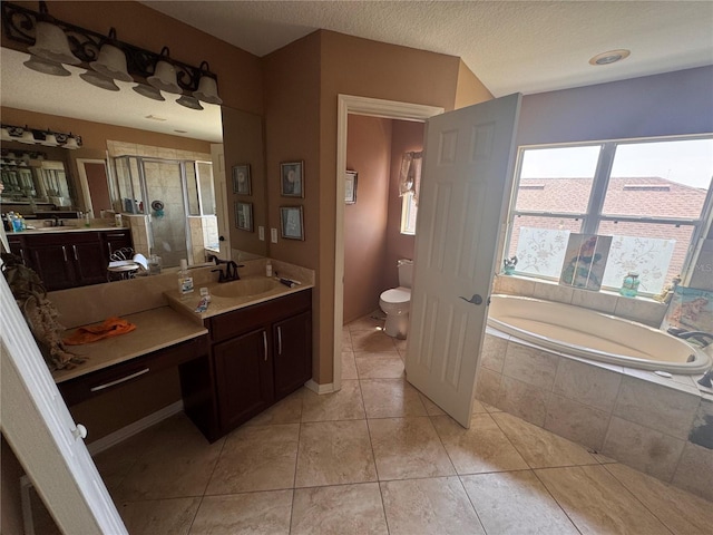 16027 Vine Cliff Ave, Hudson, FL 34667 - bathroom with a stall shower, tile patterned flooring, a bath, vanity, and a textured ceiling