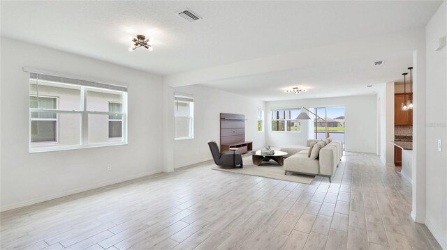 14424 59th Cir E, Bradenton, FL 34211 - living area featuring light wood-type flooring and a chandelier