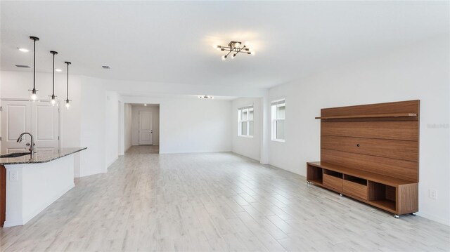 14424 59th Cir E, Bradenton, FL 34211 - unfurnished living room with a sink and light wood-type flooring