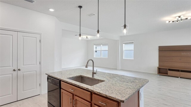 14424 59th Cir E, Bradenton, FL 34211 - kitchen with open floor plan, dishwasher, pendant lighting, brown cabinetry, and light stone counters