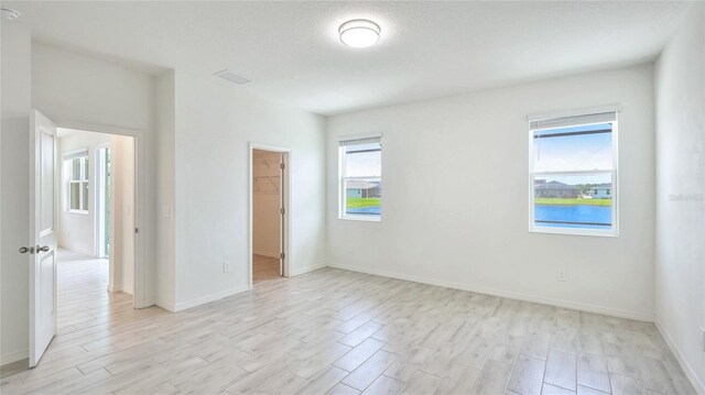 14424 59th Cir E, Bradenton, FL 34211 - spare room featuring light wood finished floors