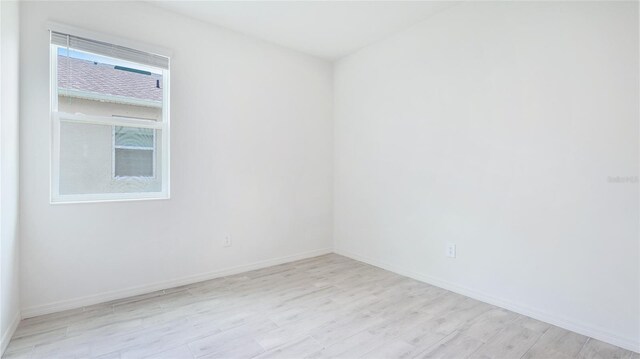 14424 59th Cir E, Bradenton, FL 34211 - empty room with light wood-style flooring and baseboards