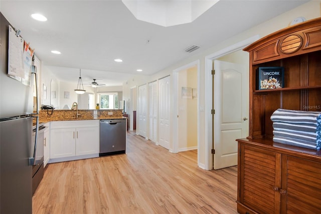 12000 Gulf Blvd Unit 403-S, Treasure Island, FL 33706 - kitchen with stainless steel appliances, a peninsula, light wood-style flooring, a ceiling fan, and recessed lighting