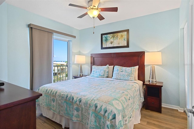 12000 Gulf Blvd Unit 403-S, Treasure Island, FL 33706 - bedroom featuring wood finished floors, access to outside, and a ceiling fan