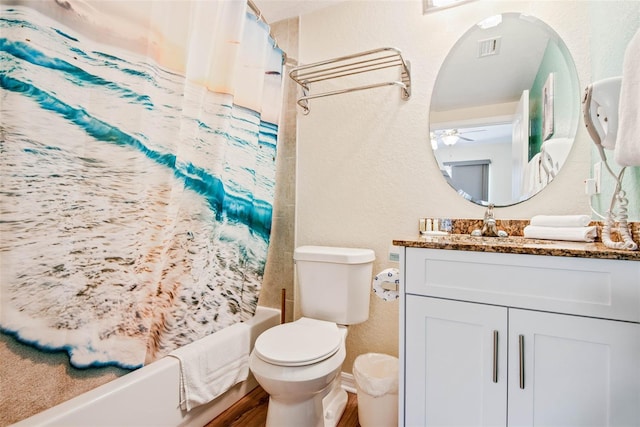 12000 Gulf Blvd Unit 403-S, Treasure Island, FL 33706 - full bath with a textured wall, vanity, shower / bathtub combination with curtain, and a ceiling fan