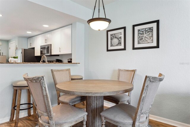 12000 Gulf Blvd Unit 403-S, Treasure Island, FL 33706 - dining area featuring recessed lighting and wood finished floors