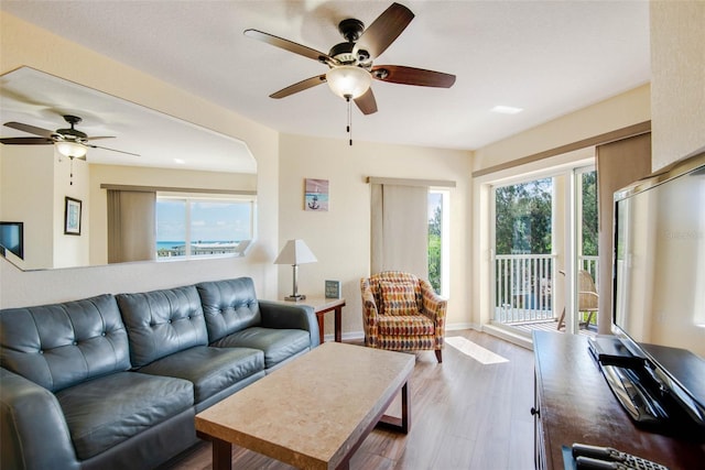 12000 Gulf Blvd Unit 403-S, Treasure Island, FL 33706 - living area with a ceiling fan and wood finished floors