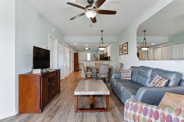 12000 Gulf Blvd Unit 403-S, Treasure Island, FL 33706 - living room with light wood-style flooring and ceiling fan