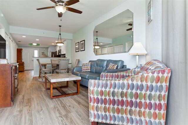 12000 Gulf Blvd Unit 403-S, Treasure Island, FL 33706 - living room featuring ceiling fan and light wood finished floors
