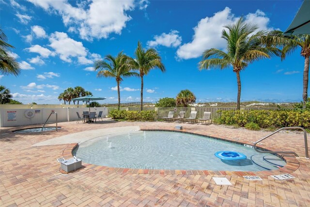 12000 Gulf Blvd Unit 403-S, Treasure Island, FL 33706 - community pool featuring a community hot tub and a patio