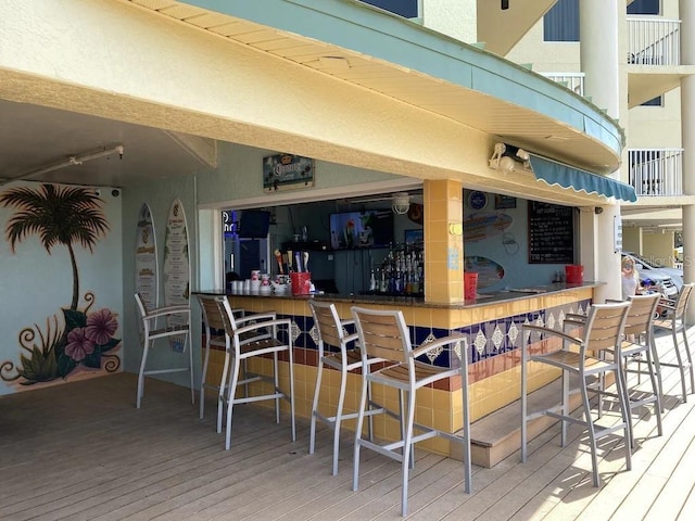 12000 Gulf Blvd Unit 403-S, Treasure Island, FL 33706 - wooden deck featuring an outdoor bar