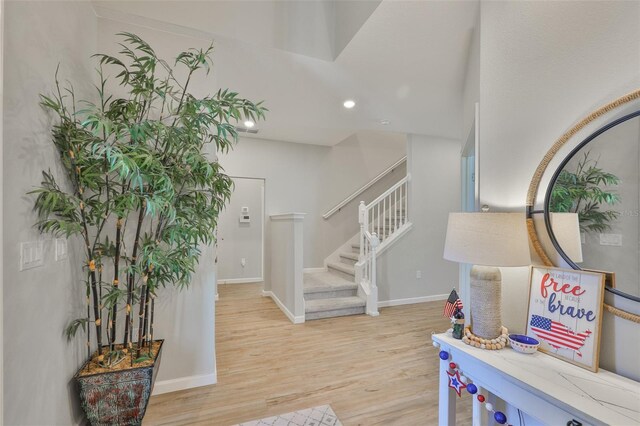 314 Blackrock Ln, Apollo Beach, FL 33572 - foyer with light wood-style flooring, recessed lighting, and stairs