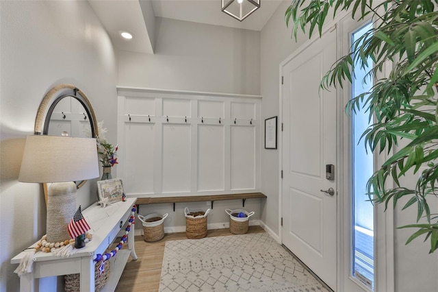314 Blackrock Ln, Apollo Beach, FL 33572 - mudroom with wood finished floors and baseboards