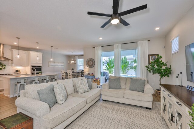 314 Blackrock Ln, Apollo Beach, FL 33572 - living room featuring a ceiling fan, light wood-type flooring, and recessed lighting