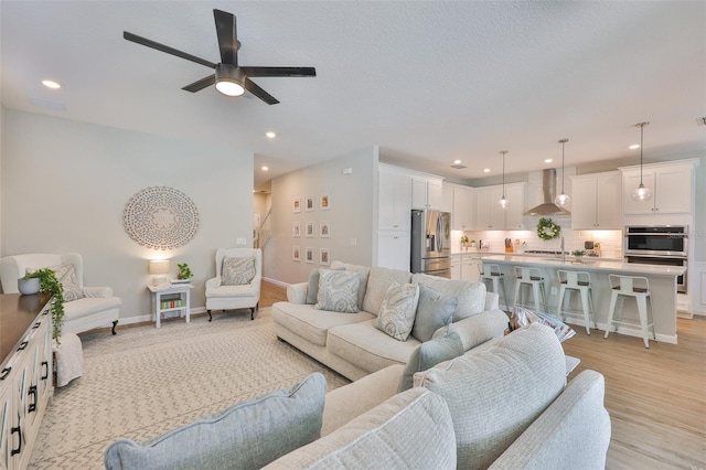 314 Blackrock Ln, Apollo Beach, FL 33572 - living area with ceiling fan, stairway, recessed lighting, and light wood-type flooring
