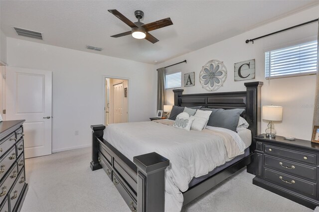 314 Blackrock Ln, Apollo Beach, FL 33572 - bedroom with light carpet, a ceiling fan, and connected bathroom
