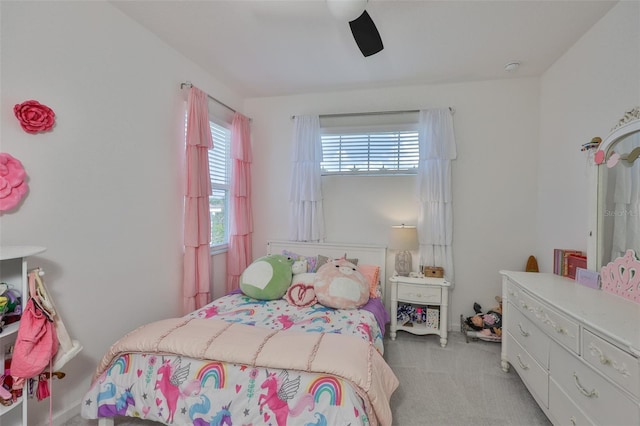 314 Blackrock Ln, Apollo Beach, FL 33572 - carpeted bedroom with multiple windows and ceiling fan
