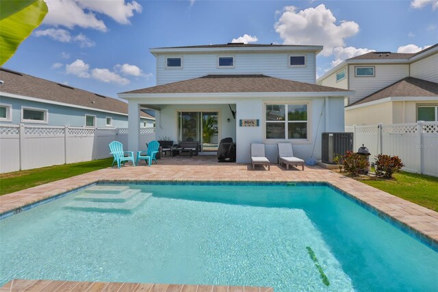 314 Blackrock Ln, Apollo Beach, FL 33572 - rear view of property with a patio area, a fenced backyard, and a shingled roof