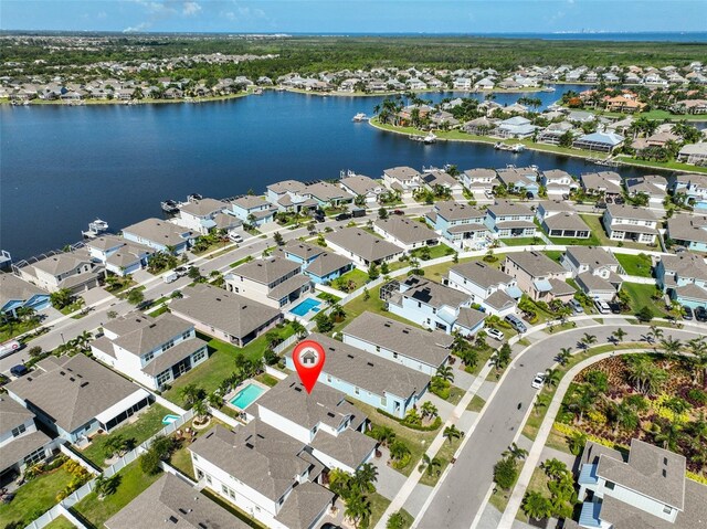 314 Blackrock Ln, Apollo Beach, FL 33572 - aerial view of property and surrounding area with nearby suburban area and a large body of water