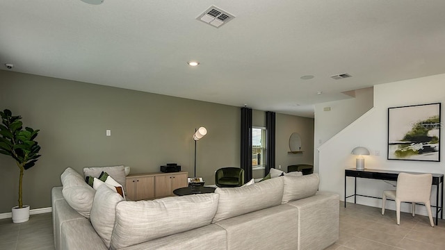 12474 Gust Ct, Hudson, FL 34669 - living room featuring light tile patterned floors