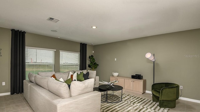 12474 Gust Ct, Hudson, FL 34669 - living area featuring light tile patterned floors and recessed lighting