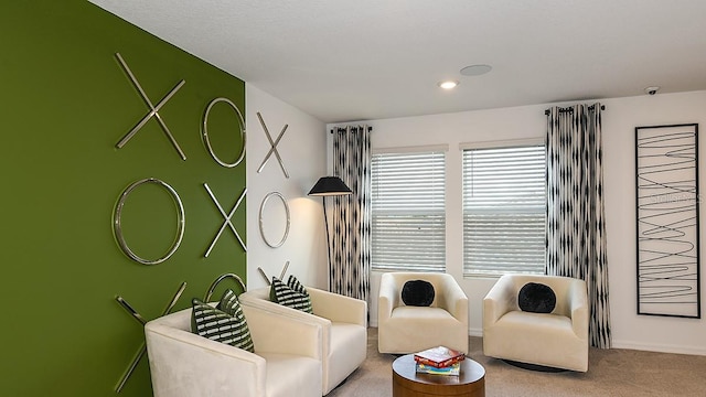 12474 Gust Ct, Hudson, FL 34669 - carpeted living room featuring baseboards