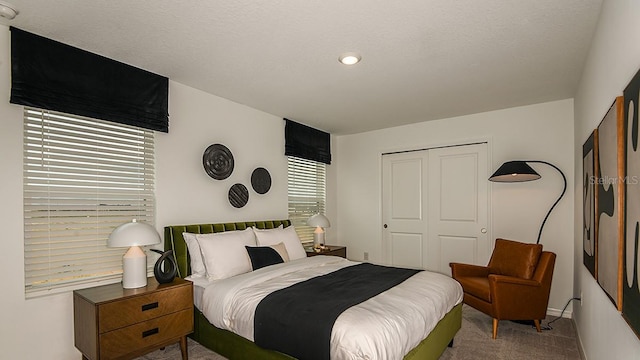 12474 Gust Ct, Hudson, FL 34669 - carpeted bedroom with a closet and baseboards