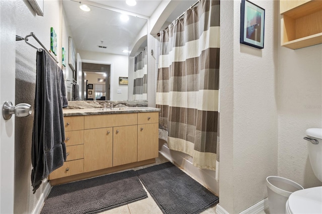 100 4th Ave S Unit 103, Saint Petersburg, FL 33701 - bathroom with vanity, shower / bath combo, a textured wall, tile patterned flooring, and recessed lighting