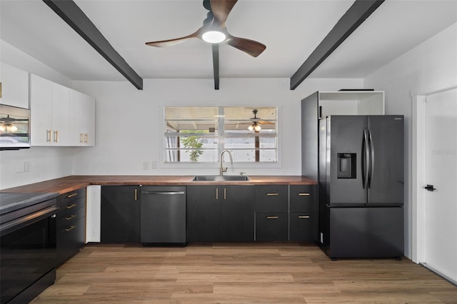 1707 Windsor Way, Tampa, FL 33619 - kitchen featuring appliances with stainless steel finishes, wooden counters, beamed ceiling, ceiling fan, and white cabinets