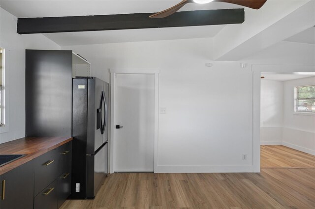 1707 Windsor Way, Tampa, FL 33619 - kitchen featuring stainless steel fridge, light wood-type flooring, wooden counters, a ceiling fan, and beamed ceiling