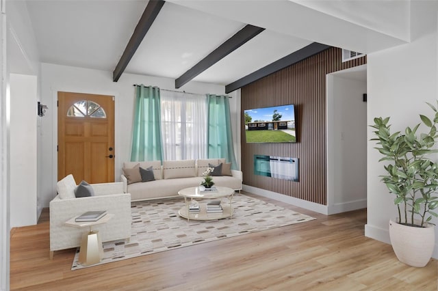 1707 Windsor Way, Tampa, FL 33619 - living area with beam ceiling and wood finished floors