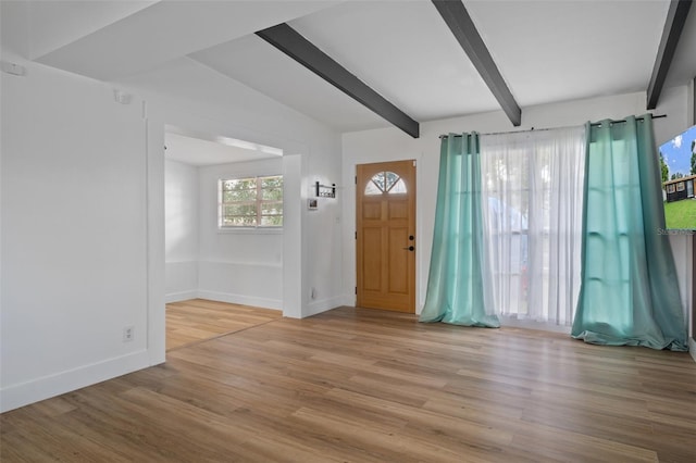 1707 Windsor Way, Tampa, FL 33619 - foyer featuring beamed ceiling and wood finished floors