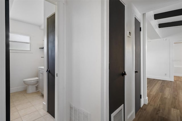 1707 Windsor Way, Tampa, FL 33619 - hallway featuring baseboards and light wood-style flooring