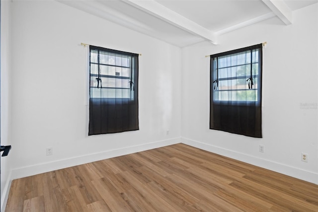 1707 Windsor Way, Tampa, FL 33619 - unfurnished room featuring beam ceiling and wood finished floors