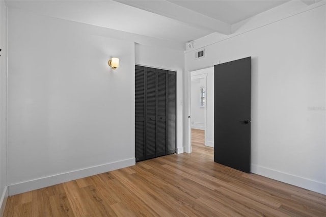 1707 Windsor Way, Tampa, FL 33619 - unfurnished bedroom with light wood-style floors and a closet