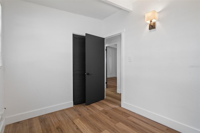 1707 Windsor Way, Tampa, FL 33619 - empty room with light wood-style flooring and baseboards