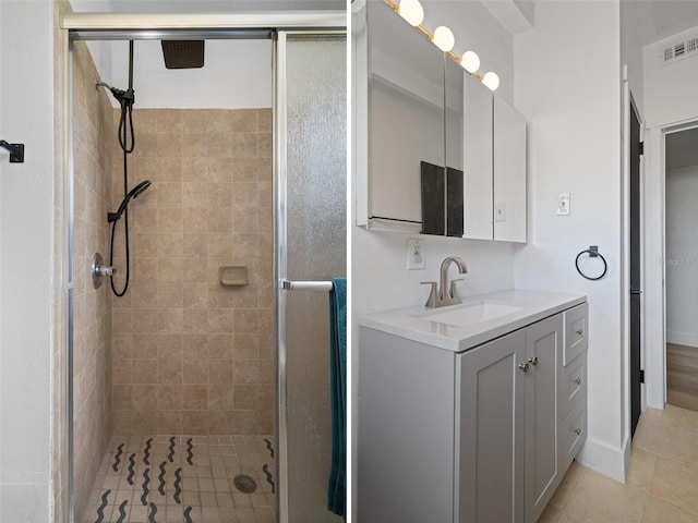 1707 Windsor Way, Tampa, FL 33619 - bathroom featuring a stall shower, vanity, and tile patterned flooring