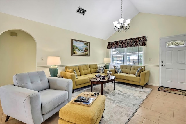 13814 Lavender Ave, Hudson, FL 34667 - living area featuring a chandelier, high vaulted ceiling, light tile patterned flooring, and arched walkways