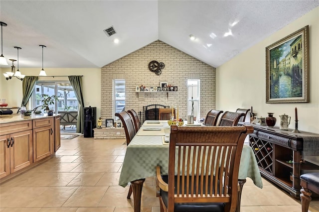 13814 Lavender Ave, Hudson, FL 34667 - dining space with lofted ceiling, brick wall, a fireplace, and light tile patterned floors