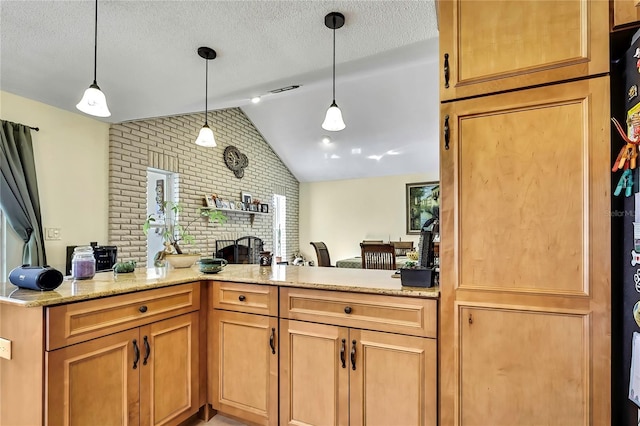 13814 Lavender Ave, Hudson, FL 34667 - kitchen featuring vaulted ceiling, a fireplace, brick wall, light stone counters, and hanging light fixtures