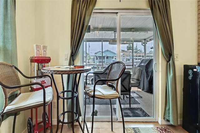 13814 Lavender Ave, Hudson, FL 34667 - dining space featuring baseboards and tile patterned flooring
