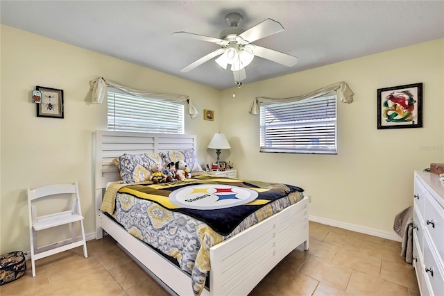 13814 Lavender Ave, Hudson, FL 34667 - bedroom featuring light tile patterned flooring and a ceiling fan
